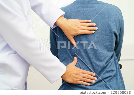 Physical therapy, Asian therapist doctor treat perform pain therapy in hospital. 129368028