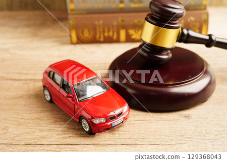 Bangkok, Thailand March 15, 2023 Car accident lawsuit and insurance, Judge hammer with car model. Bangkok, Thailand March 15, 2023 Car accident lawsuit and insurance, Judge hammer with car model. 129368043