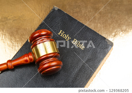 A finely crafted wooden gavel with a gold band A finely crafted wooden gavel with a gold band 129368205