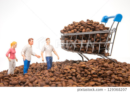Unique image of tiny figures standing on coffee beans, a cart brimming with beans 129368207