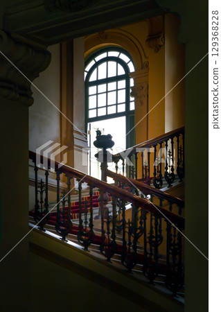 Architectural splendour of Vintage stairway banister or Staircase handrails leading into hallway on the 2nd floor. 129368228