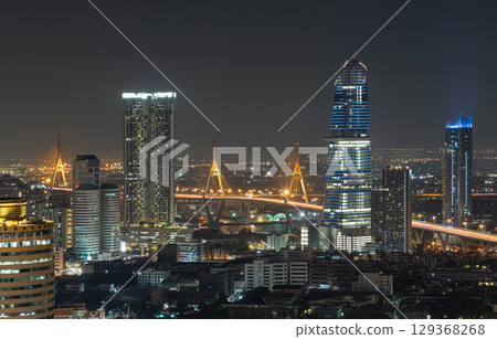 Night view after sunset of Skyscrapers in the business district and Bhumibol Bridge. 129368268
