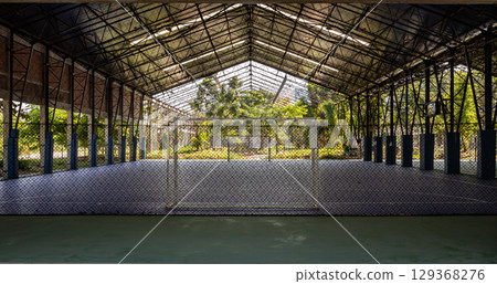 Soccer goal or Football gate with white net inside indoor Futsal court at city park. 129368276