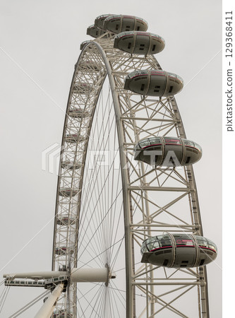 a portion of the London Eye or the iconic observation wheel. a portion of the London Eye or the iconic observation wheel. 129368411