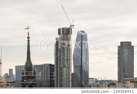 Prominent architectural structures with skyline city view of london, including One Blackfriars and other notable buildings in the financial district. Prominent architectural structures with skyline city view of london, including One Blackfriars and other notable buildings in the financial district. 129368451
