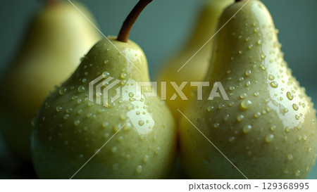 Close-up shot of fresh pears covered in glistening water droplets a vibrant display of freshness 129368995