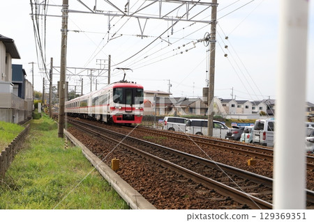 Trains passing through a railroad crossing - Meitetsu trains near Fujikawa-juku Trains passing through a railroad crossing - Meitetsu trains near Fujikawa-juku 129369351