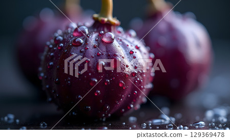 Close up of ripe and juicy grapes covered in water droplets exhibiting freshness and allure Close up of ripe and juicy grapes covered in water droplets exhibiting freshness and allure 129369478