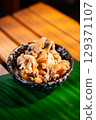 The Fried pork rinds in bowl for food concept. 129371107