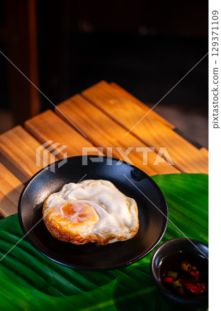 The fried egg Thai style for  food concept. 129371109
