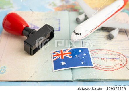 Australia flag and passport with airplane for travel. 129373119