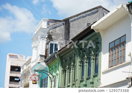 Detailed view of windows, doors and balconies of city buildings Detailed view of windows, doors and balconies of city buildings 129373388