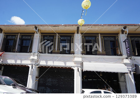 Detailed view of windows, doors and balconies of city buildings  129373389