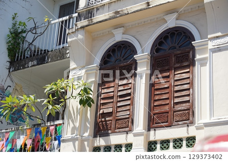 Detailed view of windows, doors and balconies of city buildings Detailed view of windows, doors and balconies of city buildings 129373402