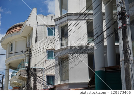 Detailed view of windows, doors and balconies of city buildings  129373406
