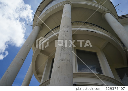 Detailed view of windows, doors and balconies of city buildings  129373407