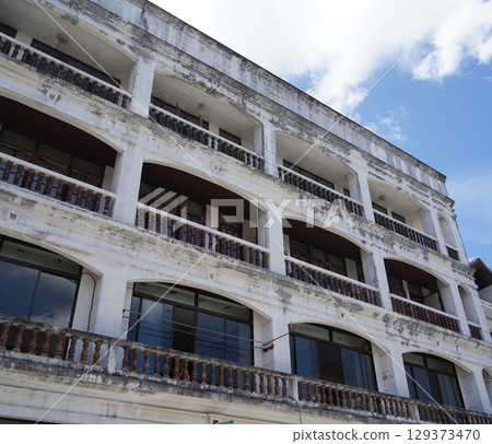 Detailed view of windows, doors and balconies of city buildings  129373470