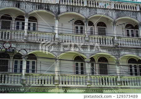 Detailed view of windows, doors and balconies of city buildings Detailed view of windows, doors and balconies of city buildings 129373489