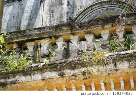 Detailed view of windows, doors and balconies of city buildings  129374023
