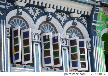 Detailed view of windows, doors and balconies of city buildings  129374037