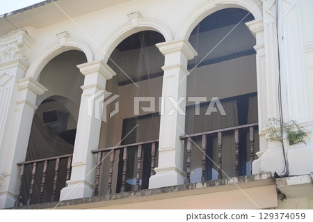 Detailed view of windows, doors and balconies of city buildings  129374059