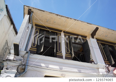 Detailed view of windows, doors and balconies of city buildings Detailed view of windows, doors and balconies of city buildings 129374065