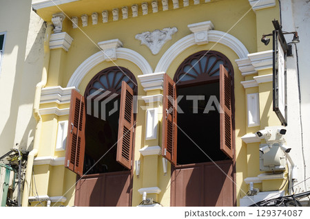 Detailed view of windows, doors and balconies of city buildings Detailed view of windows, doors and balconies of city buildings 129374087