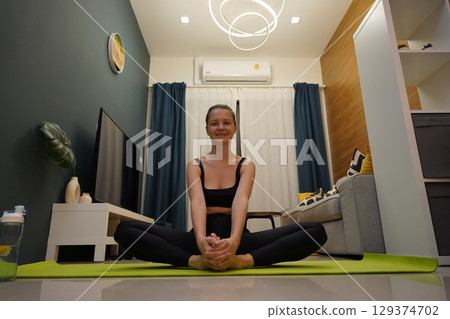 A young woman have a joyfully yoga practice A young woman have a joyfully yoga practice 129374702