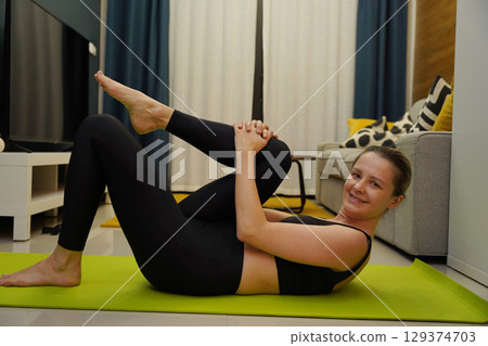 A young woman have a joyfully yoga practice A young woman have a joyfully yoga practice 129374703
