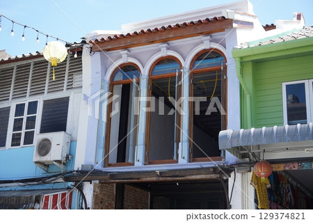 Detailed view of windows, doors and balconies of city buildings Detailed view of windows, doors and balconies of city buildings 129374821