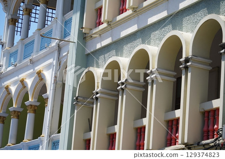 Detailed view of windows, doors and balconies of city buildings  129374823
