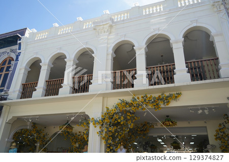 Detailed view of windows, doors and balconies of city buildings  129374827