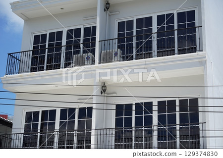 Detailed view of windows, doors and balconies of city buildings Detailed view of windows, doors and balconies of city buildings 129374830