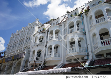 Detailed view of windows, doors and balconies of city buildings  129374839