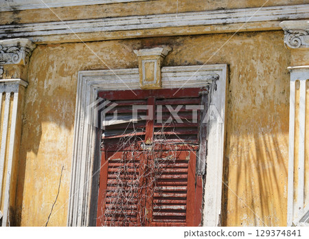 Detailed view of windows, doors and balconies of city buildings  129374841