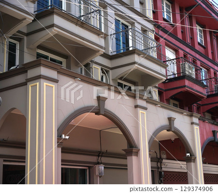 Detailed view of windows, doors and balconies of city buildings Detailed view of windows, doors and balconies of city buildings 129374906