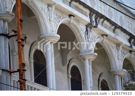 Detailed view of windows, doors and balconies of city buildings  129374910