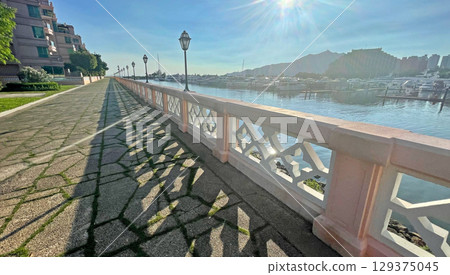 Residential buildings, outdoor footpath lane near yacht club and the lake Residential buildings, outdoor footpath lane near yacht club and the lake 129375045