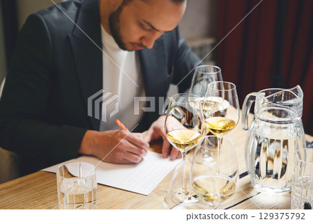 Sommelier examination to get certificate professional work of winemaking. Sommelier degustate wine. Sommelier examination to get certificate professional work of winemaking. Sommelier degustate wine. 129375792
