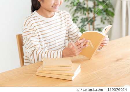 A middle school girl reading at home A middle school girl reading at home 129376954