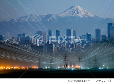 Night view of electricity towers leading to the city under Mount Fuji, shining energy lines 129377071