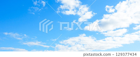A simple landscape of blue sky and clouds 129377434