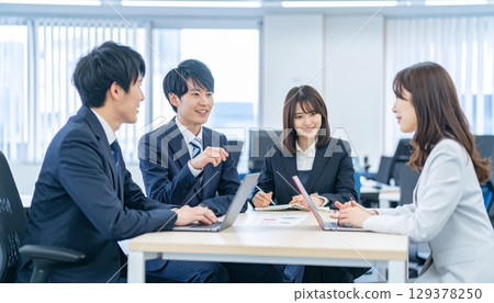 Young employees having a meeting with smiles Young employees having a meeting with smiles 129378250