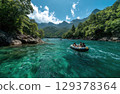 friends on a yellow raft in the emerald blue River with the sun shining and mountains 129378364