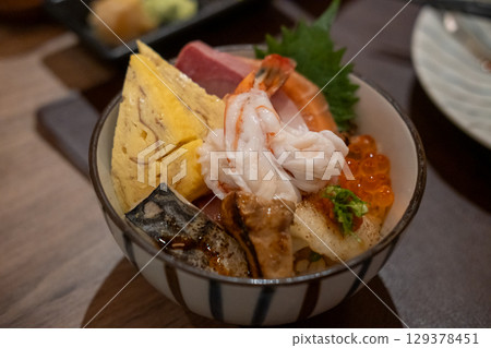 Kaisen Don, a Japanese rice bowl dish of seafood. Including raw fish such as Salmon, Saba, Engawa, Foie gras, Ikura. 129378451