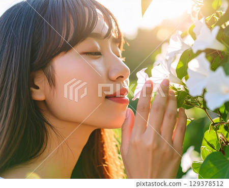 Morning glory and young woman 129378512