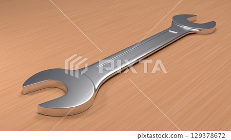 Wrench on a wooden table Wrench on a wooden table 129378672