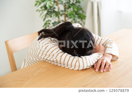 A middle school girl worried at home A middle school girl worried at home 129378879