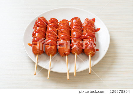 fried sausage skewer with ketchup fried sausage skewer with ketchup 129378894
