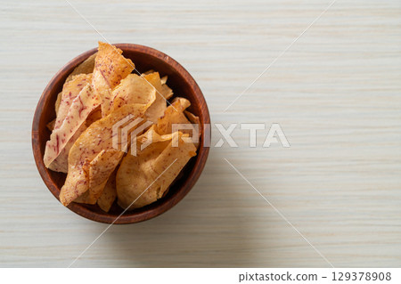 Taro Chips - fried or baked sliced taro Taro Chips - fried or baked sliced taro 129378908